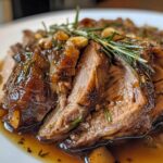 tender slow roasted lamb shoulder glazed with rosemary garlic and honey
